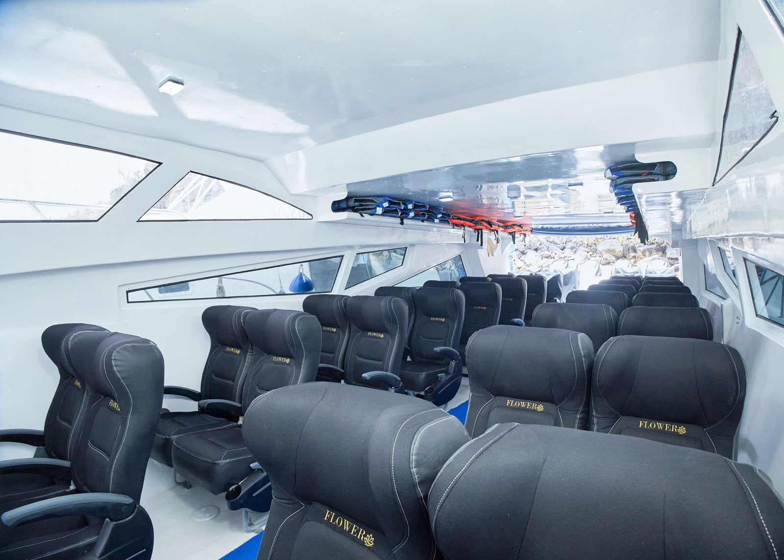 Comfortable reclining seats inside the Flower ferry cabin