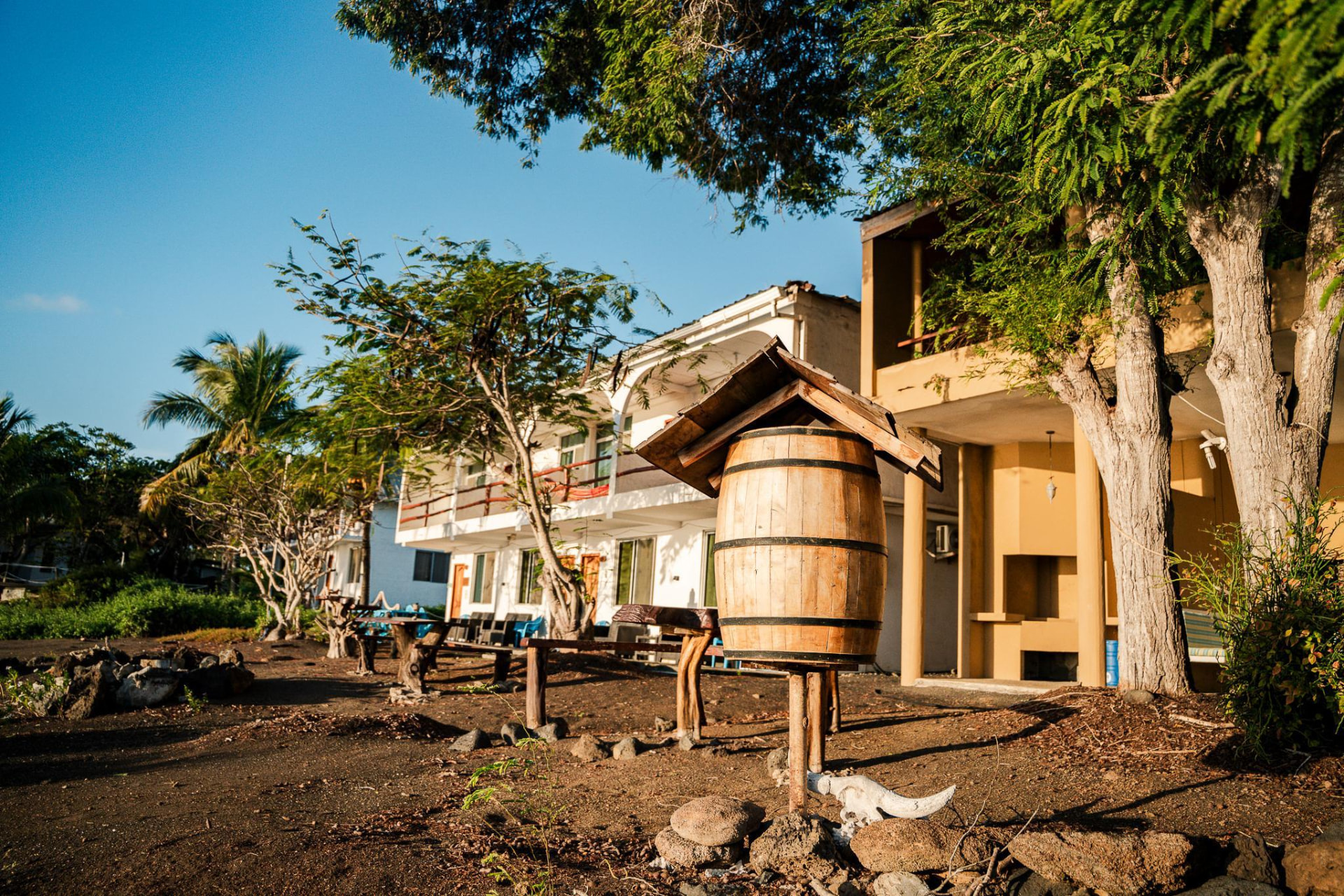 Replica of the historic Floreana mail barrel under a wooden roof