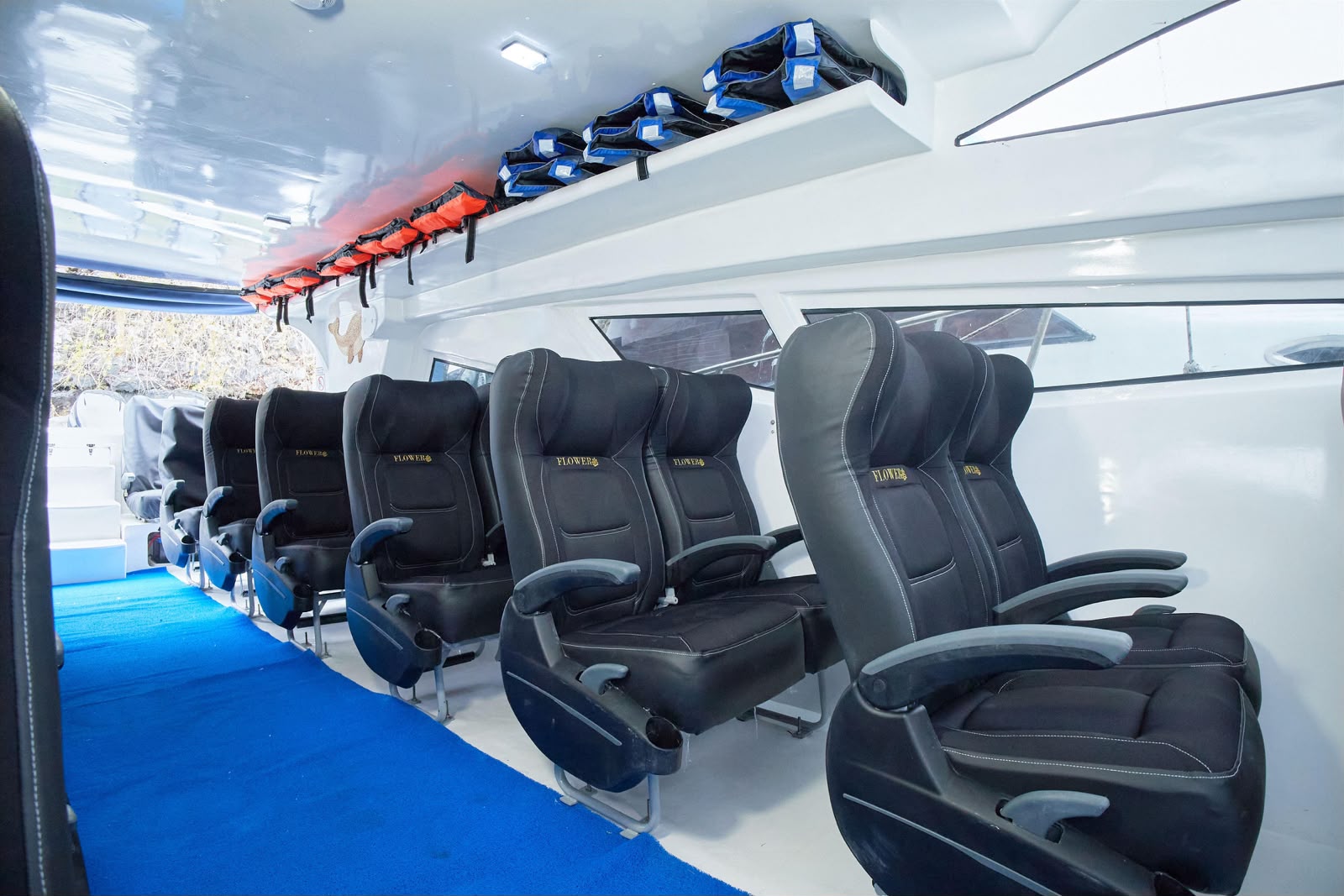 Rows of seats and life jackets aboard the Flower ferry